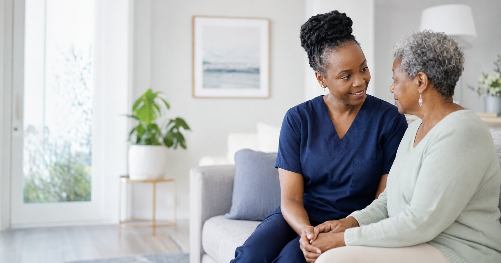 A nurse speaking with a client at home